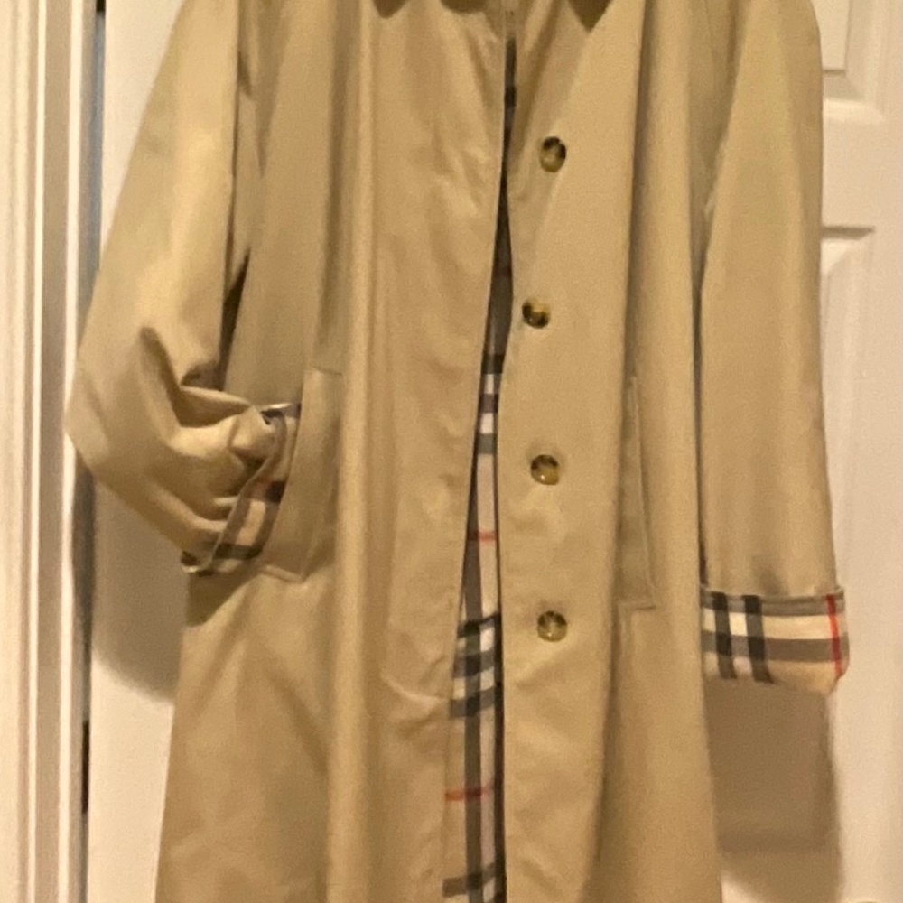 Burberry tan mid length car coat with classic plaid lining.  Made in England